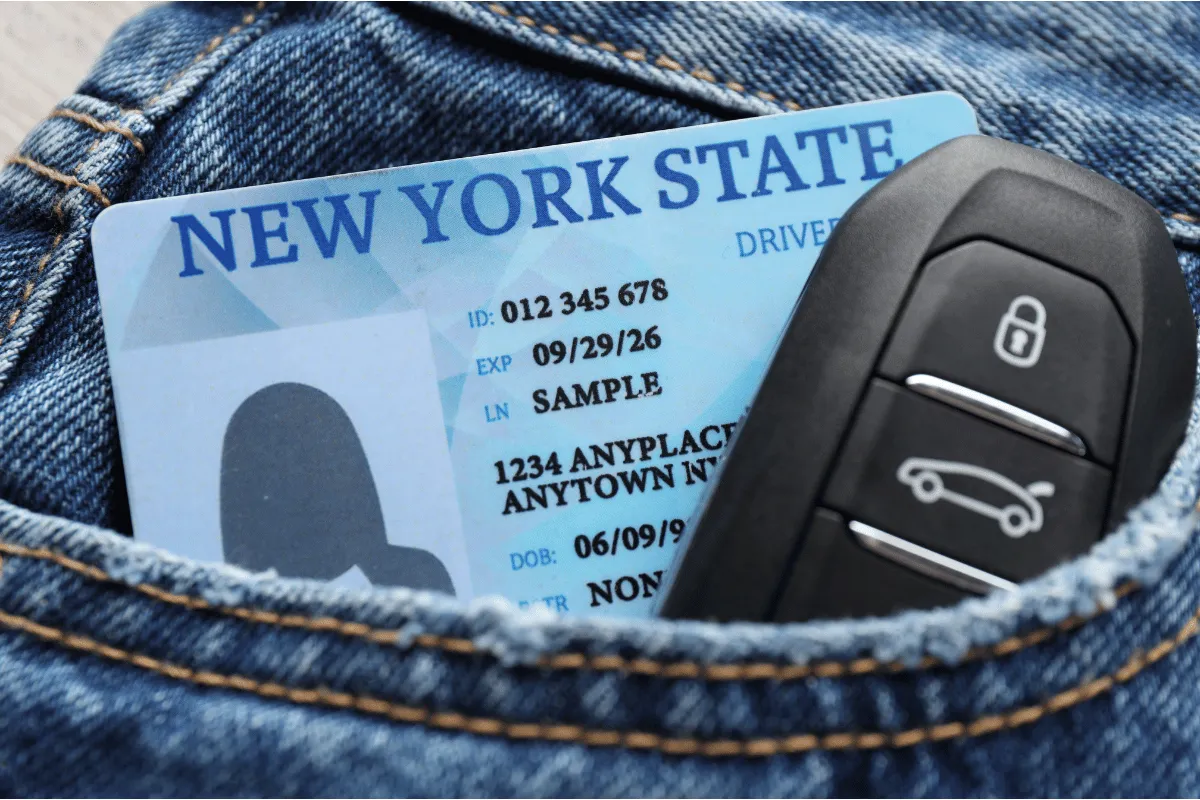 Aggravated Unlicensed Operation Traffic Stop Image of New York State ID in a back jean pock with car keys for a NY motorist facing unlicensed operation arrest.