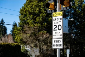 A school zone speed limit sign posted near an Orange County, NY school stating plainly 20 mph and Fines Doubled.